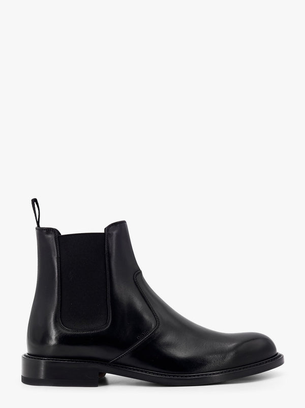 Shiny leather boots with engraved logo on the side