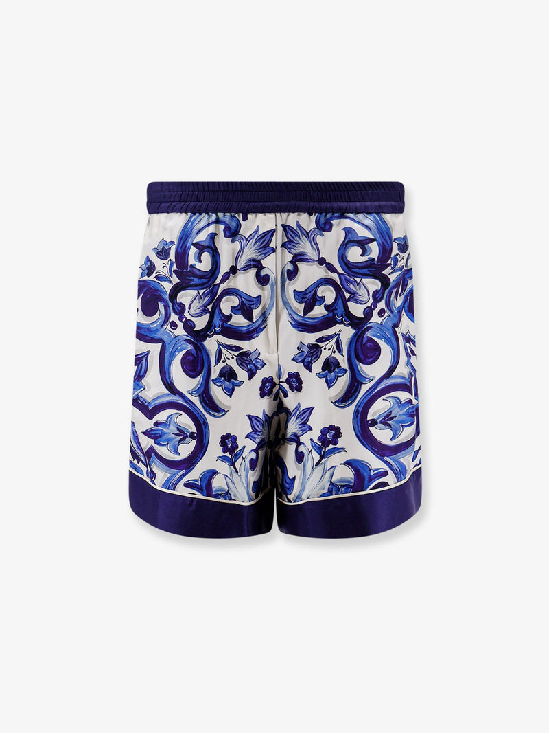 Dolce & Gabbana Dolce & Gabbana Pantalones cortos de seda con estampado de mayólica azules - World Class Fashion