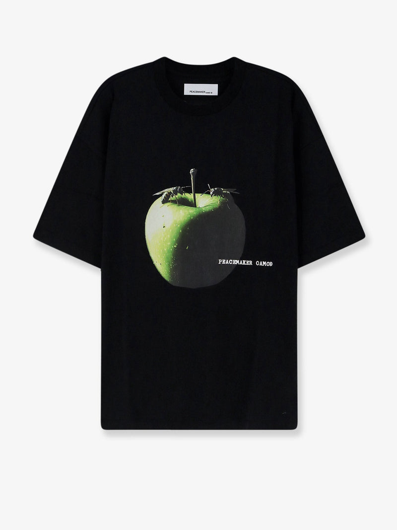 Oamc Peacemaker Camiseta negra Oamc Peacemaker con estampado de manzana - World Class Fashion