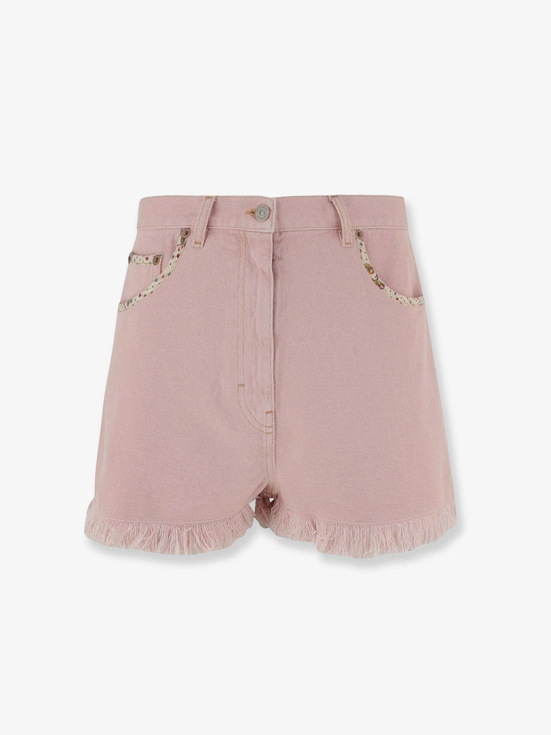 Valentino Pantalones cortos vaqueros Valentino con bordes deshilachados de color rosa - World Class Fashion