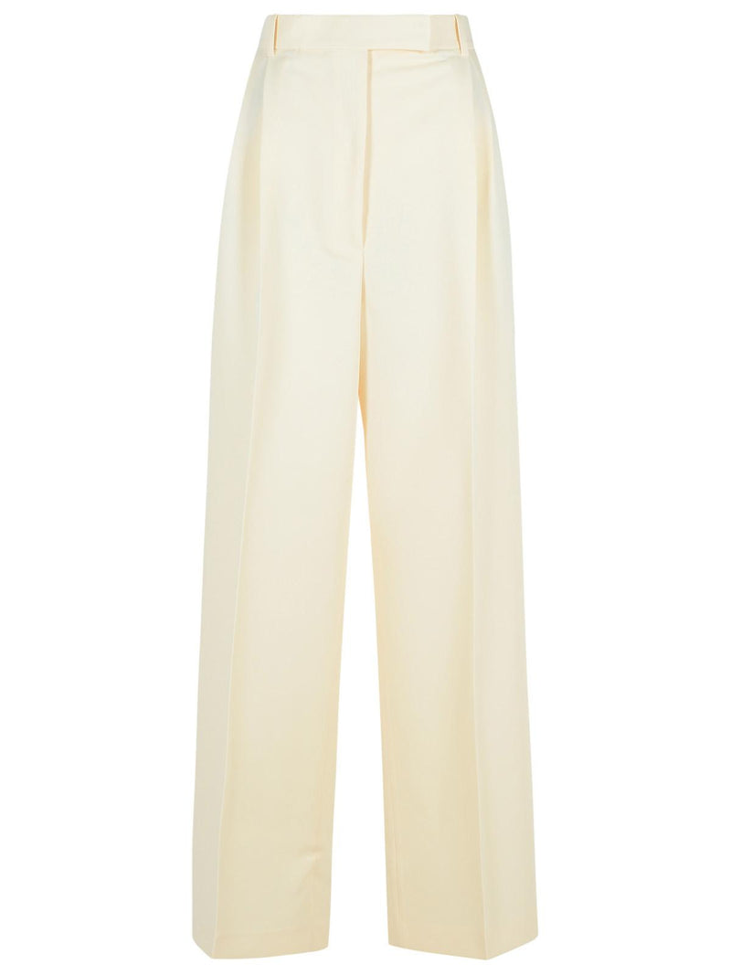 Róhe Pantalones Róhe ajustados color crema de poliéster reciclado - World Class Fashion